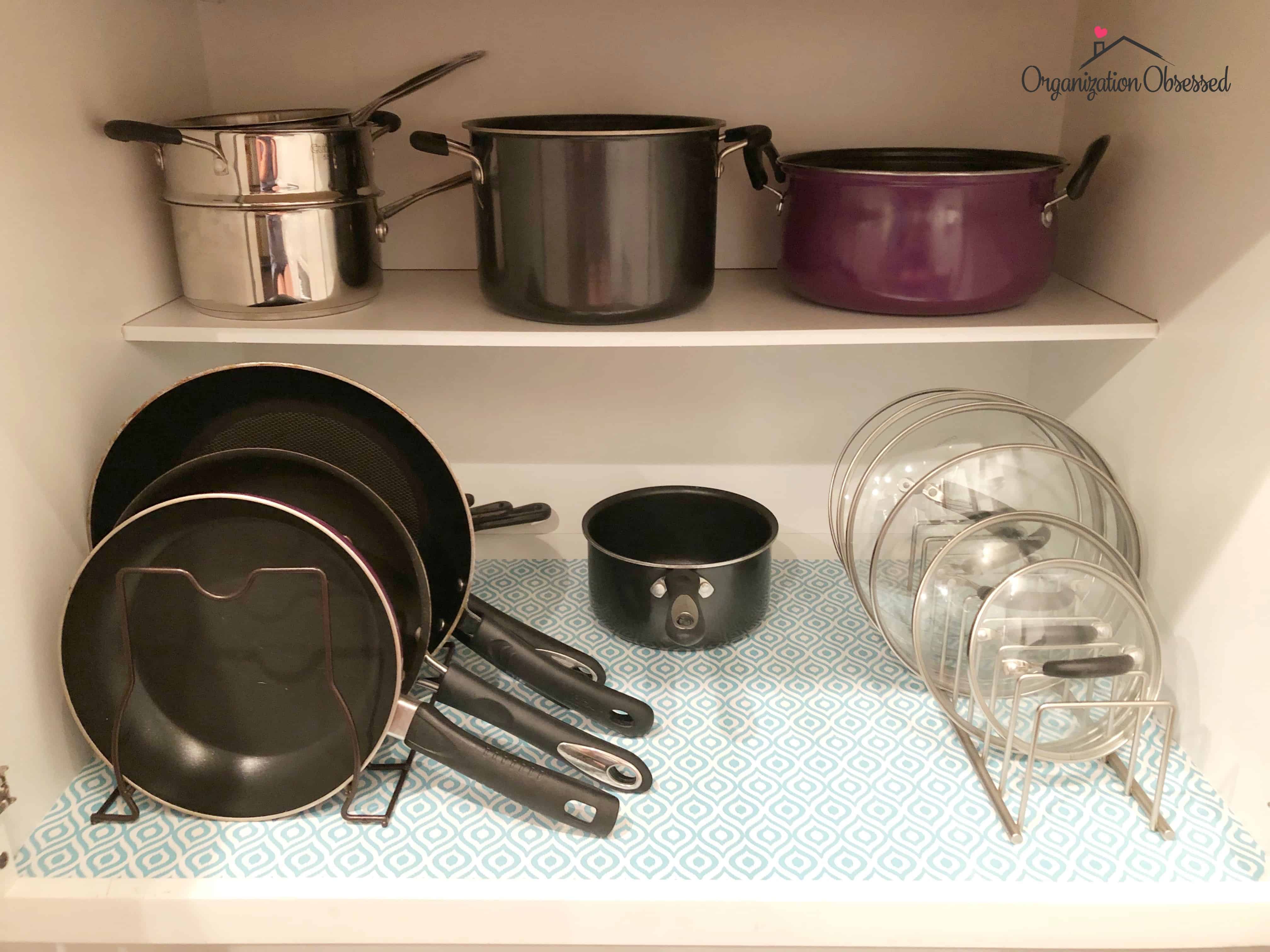 https://www.organizationobsessed.com/wp-content/uploads/2018/07/How-to-organize-pots-and-pans-3.jpg